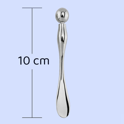 Espátula cosmética equipada con bola para masaje facial y contorno de ojos