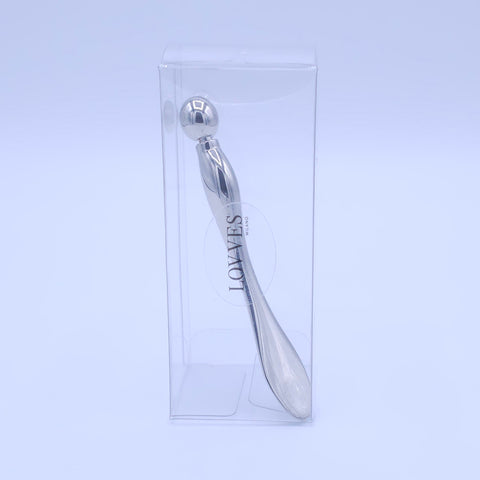 Espátula cosmética equipada con bola para masaje facial y contorno de ojos